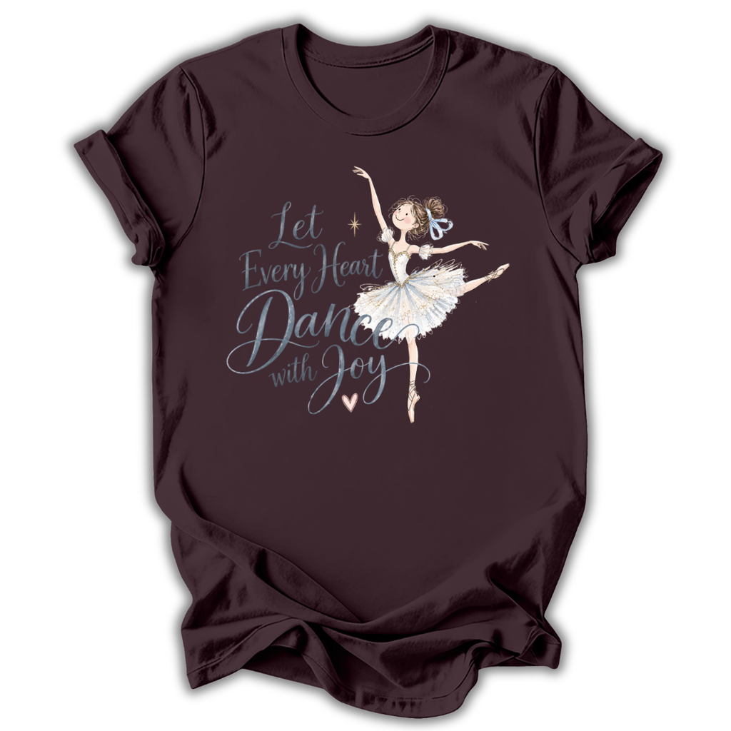 Brown short-sleeve t-shirt with a graphic of a ballerina and the text 'Let Every Heart Dance with Joy' in white and light blue, displayed on a clean white background.