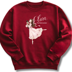 A maroon youth crewneck sweatshirt featuring an illustration of Clara in a graceful pink ballet pose with delicate 'The Nutcracker' lettering.