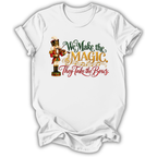 A white short-sleeve t-shirt printed with the “We Make the Magic” Nutcracker graphic design.