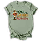A sage green short-sleeve t-shirt printed with the “We Make the Magic” Nutcracker graphic design.