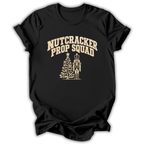 A black short-sleeve t-shirt printed with the “Nutcracker Prop Squad” graphic design.