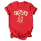 A red short-sleeve t-shirt printed with the “Nutcracker Prop Squad” graphic design.