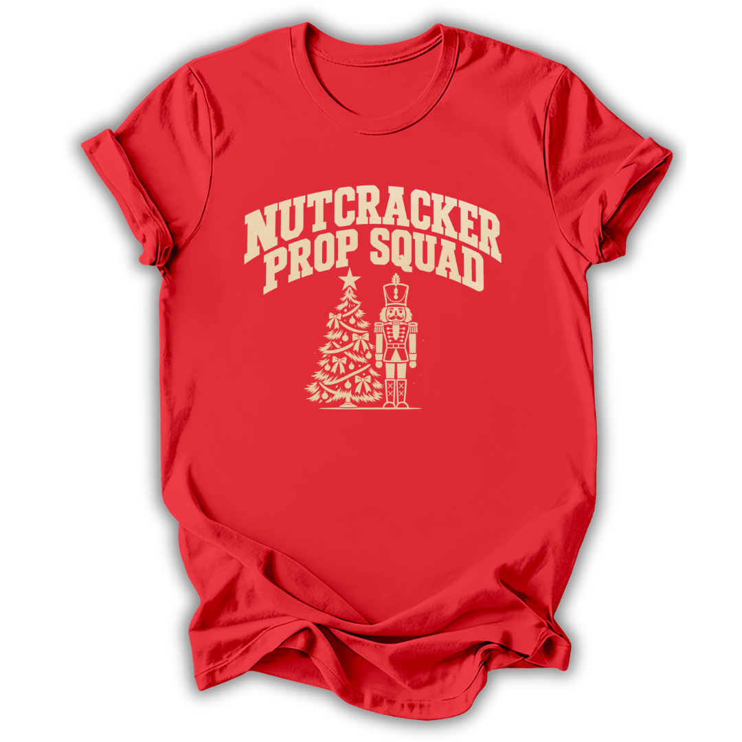 A red short-sleeve t-shirt printed with the “Nutcracker Prop Squad” graphic design.