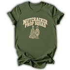 A military green short-sleeve t-shirt printed with the “Nutcracker Prop Squad” graphic design.