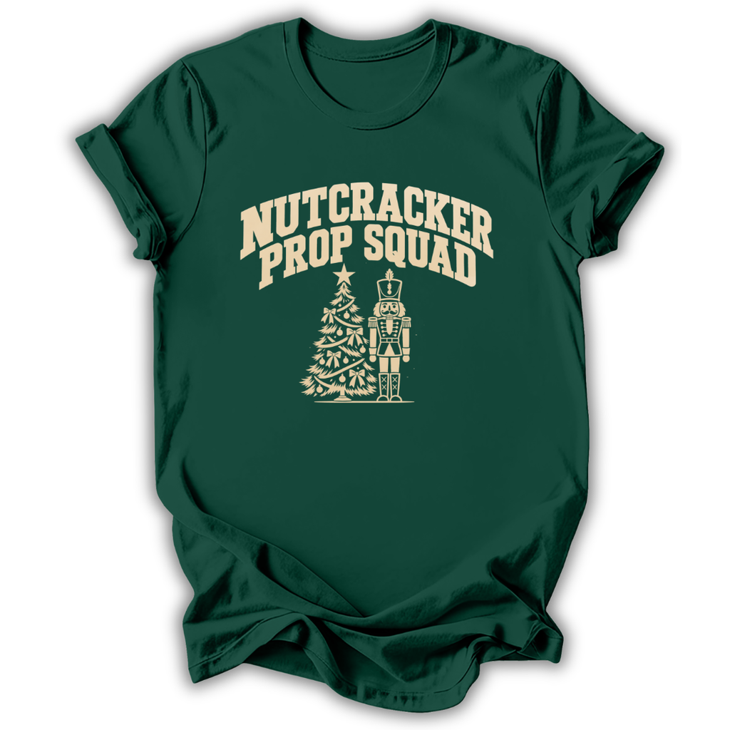 A forest green short-sleeve t-shirt printed with the “Nutcracker Prop Squad” graphic design.