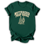 A forest green short-sleeve t-shirt printed with the “Nutcracker Prop Squad” graphic design.
