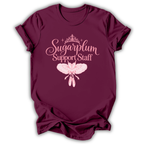 A maroon short-sleeve t-shirt printed with the “Sugarplum Support Staff” Nutcracker graphic design.