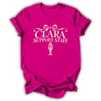 An antique heliconia pink short-sleeve t-shirt printed with the “Clara Support Staff” Nutcracker graphic design.