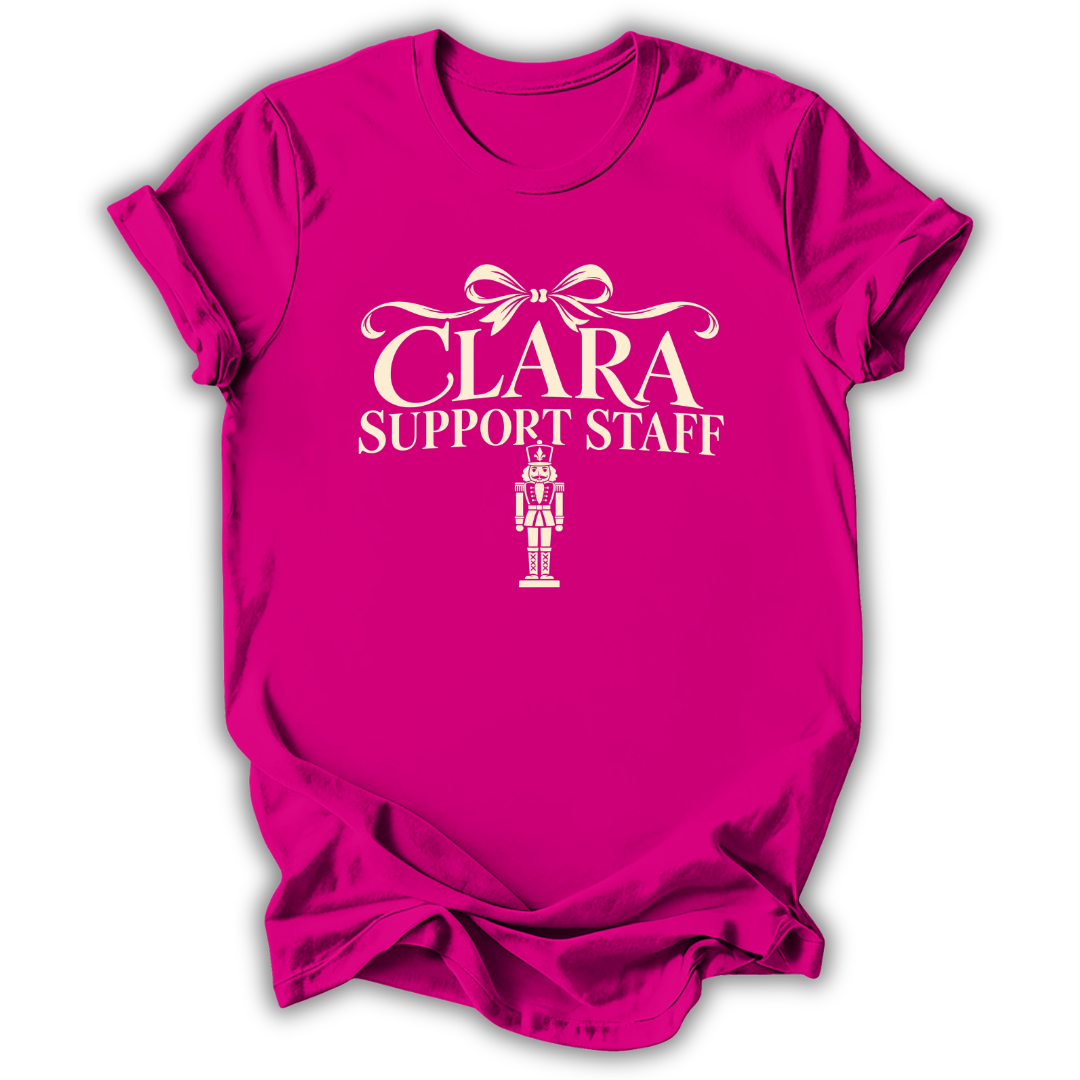 An antique heliconia pink short-sleeve t-shirt printed with the “Clara Support Staff” Nutcracker graphic design.