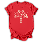 A red short-sleeve t-shirt printed with the “Clara Support Staff” Nutcracker graphic design.