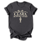 A dark heather gray short-sleeve t-shirt printed with the “Clara Support Staff” Nutcracker graphic design.