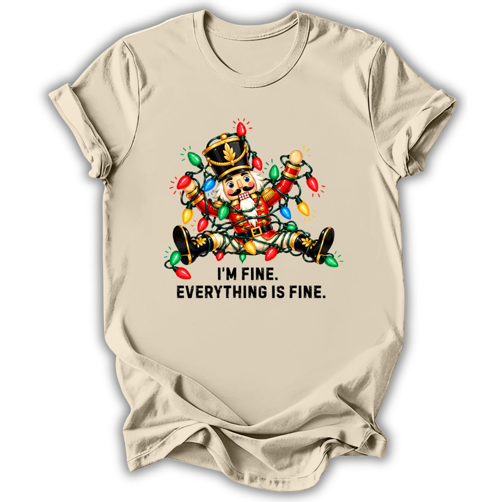 A natural cream short-sleeve t-shirt printed with the “I’m Fine Nutcracker” graphic design.