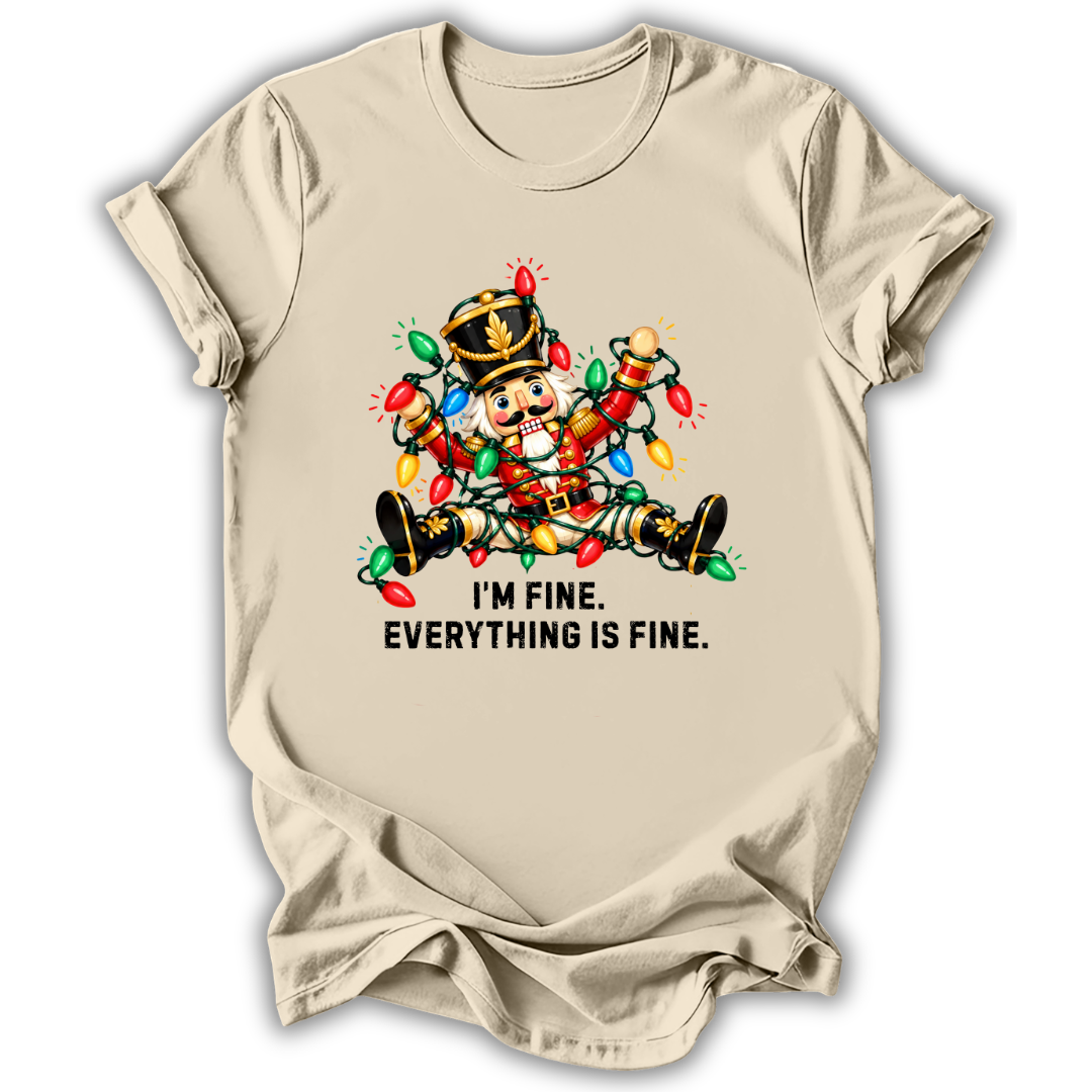 A natural cream short-sleeve t-shirt printed with the “I’m Fine Nutcracker” graphic design.