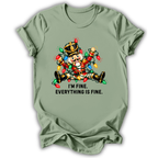 A sage green short-sleeve t-shirt printed with the “I’m Fine Nutcracker” graphic design.