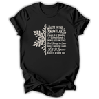 A black short-sleeve t-shirt printed with the “Nutcracker Snowflakes” graphic design.