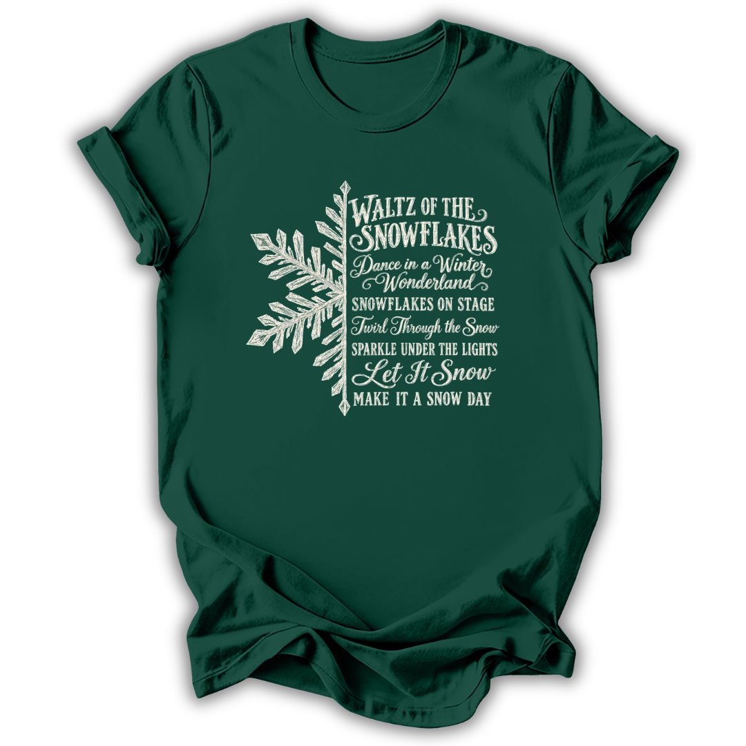 A forest green short-sleeve t-shirt printed with the “Nutcracker Snowflakes” graphic design.