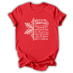 A red short-sleeve t-shirt printed with the “Nutcracker Snowflakes” graphic design.