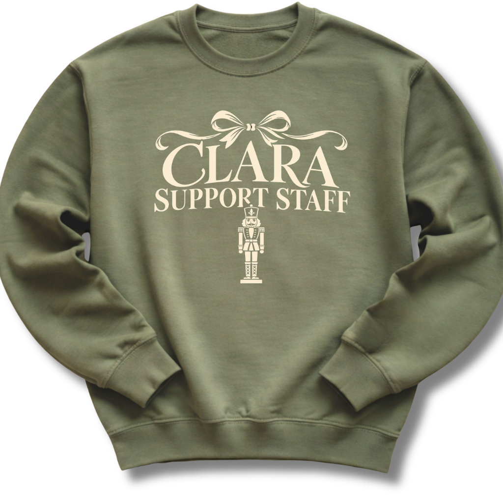 A military green crewneck sweatshirt featuring a 'Clara Support Staff' Nutcracker graphic.