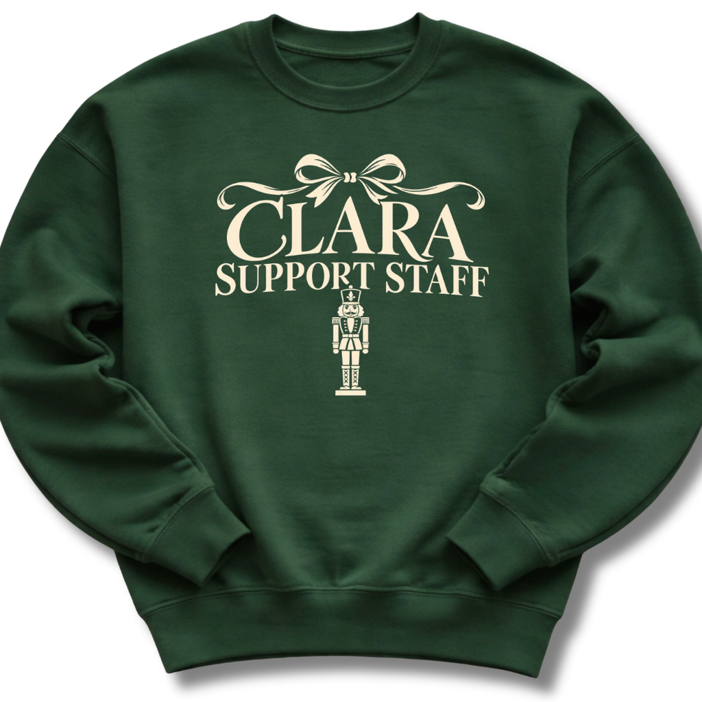 A forest green crewneck sweatshirt featuring a 'Clara Support Staff' Nutcracker graphic.