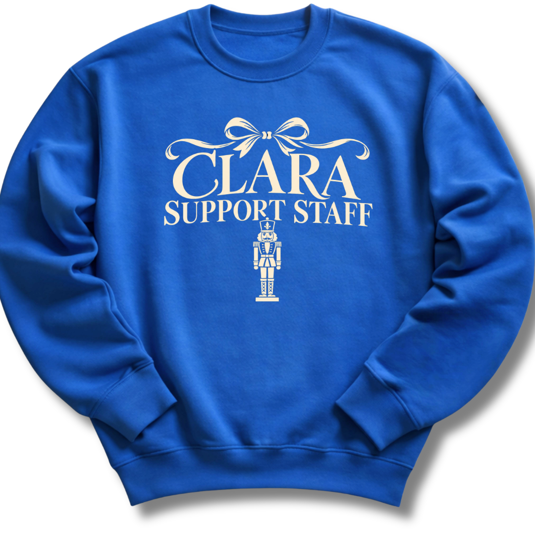 A royal blue crewneck sweatshirt featuring a 'Clara Support Staff' Nutcracker graphic.