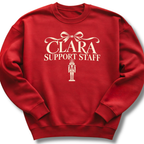 A red crewneck sweatshirt featuring a 'Clara Support Staff' Nutcracker graphic.