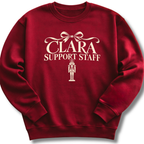 A maroon crewneck sweatshirt featuring a 'Clara Support Staff' Nutcracker graphic.