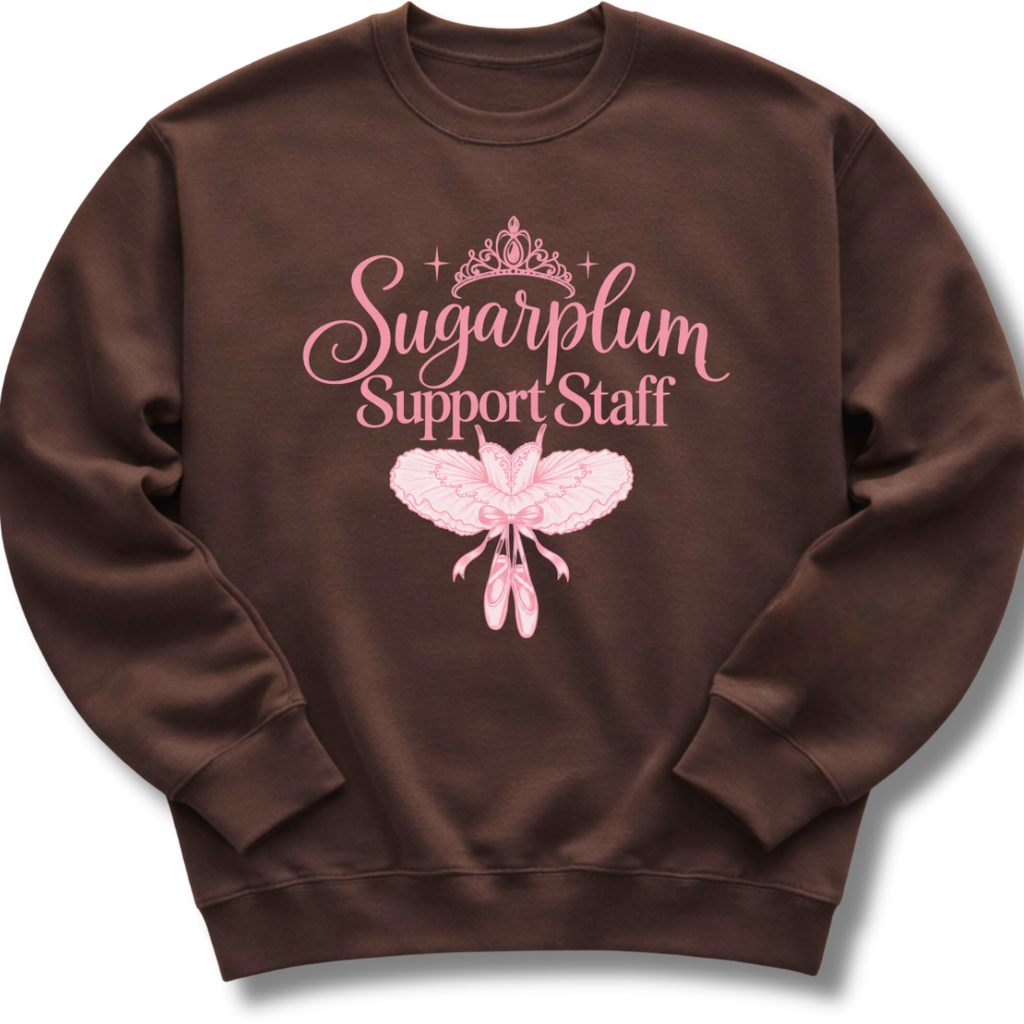 A dark brown crewneck sweatshirt featuring pink 'Sugarplum Support Staff' lettering with a delicate floral design.