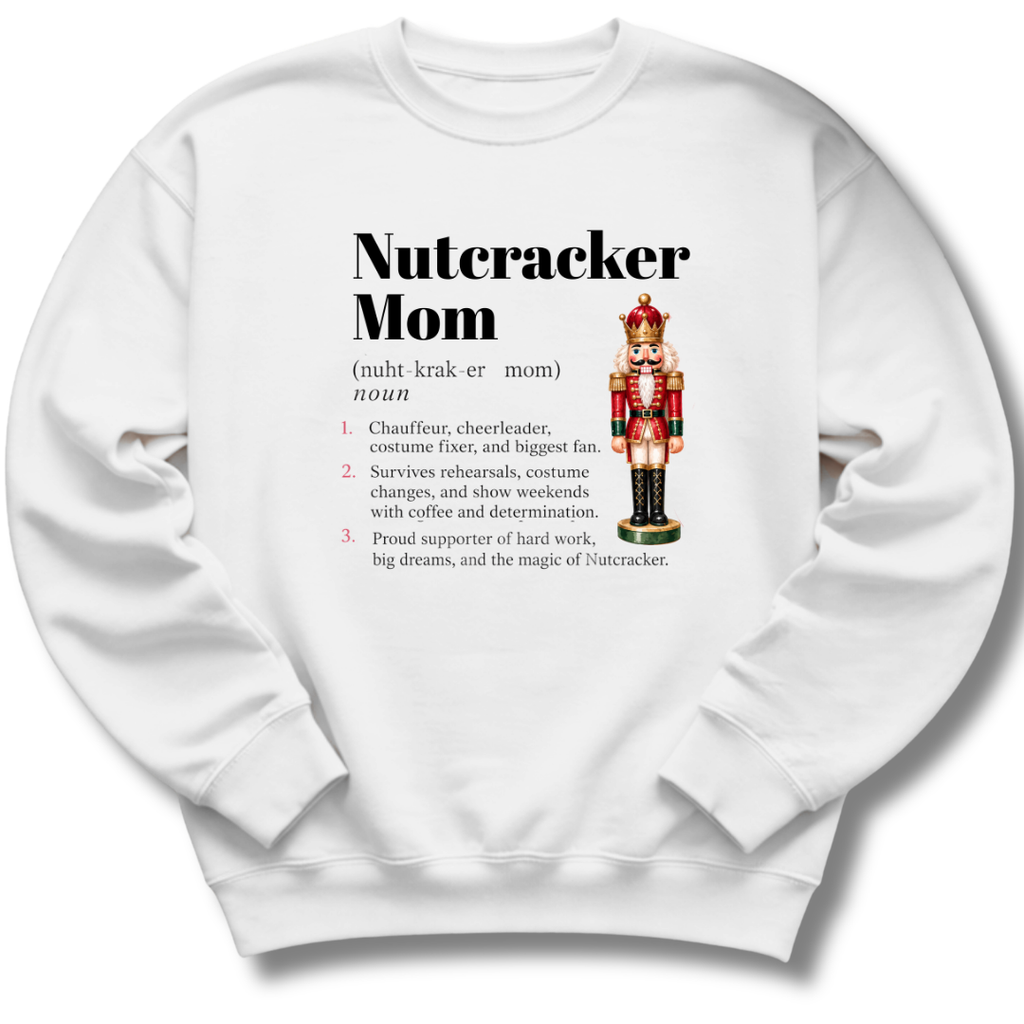A white crewneck sweatshirt featuring a dictionary-style definition of 'Nutcracker Mom'.