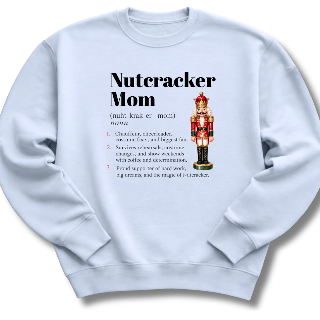 A light blue crewneck sweatshirt featuring a dictionary-style definition of 'Nutcracker Mom'.
