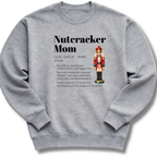 A heather gray crewneck sweatshirt featuring a dictionary-style definition of 'Nutcracker Mom'.
