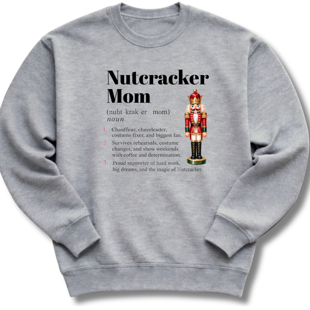 A heather gray crewneck sweatshirt featuring a dictionary-style definition of 'Nutcracker Mom'.
