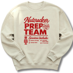 A sand-colored crewneck sweatshirt featuring a vintage-inspired red 'Nutcracker Prep Team' design.