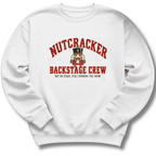 A white crewneck sweatshirt featuring a vintage-inspired nutcracker with 'Backstage Crew' lettering.