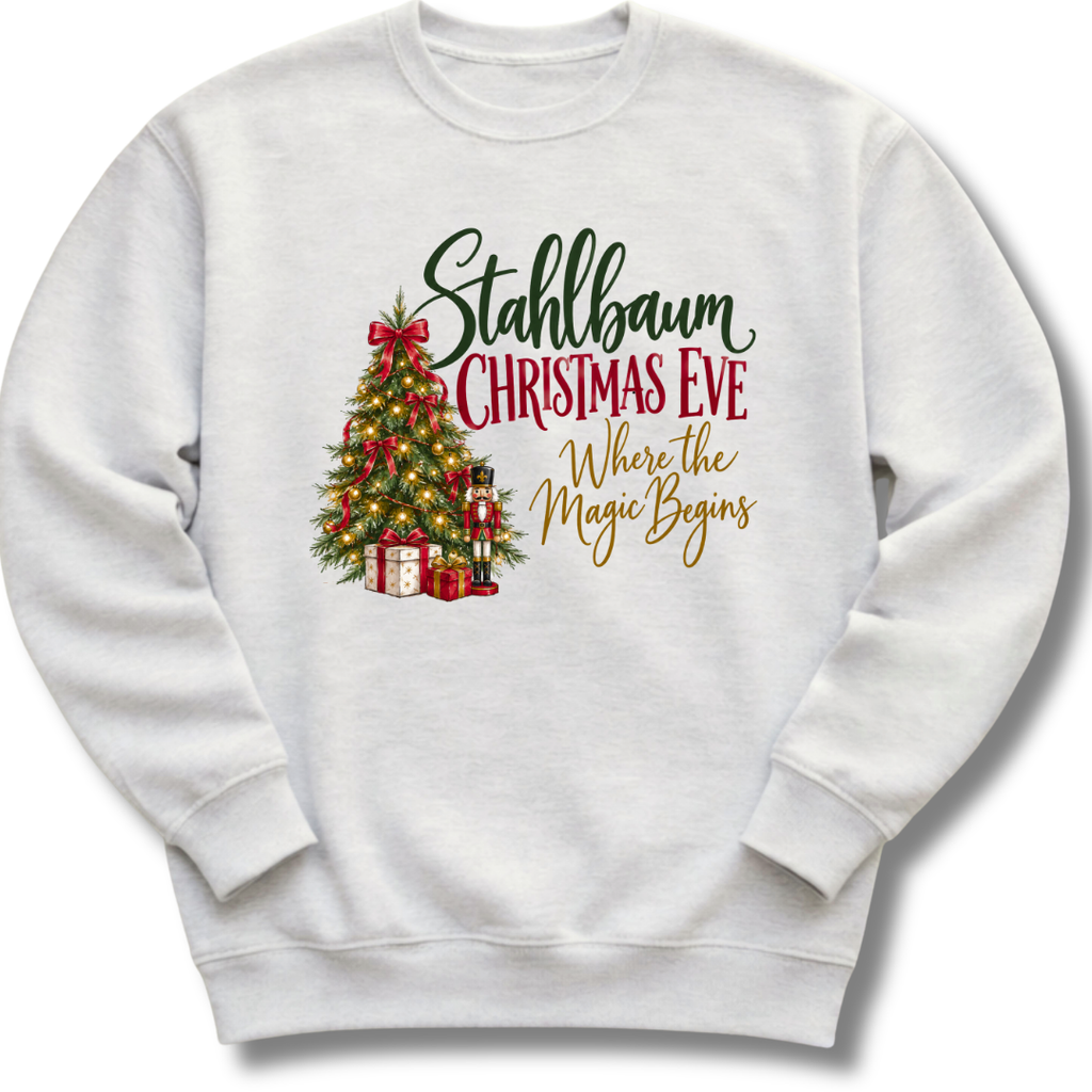 A light ash gray crewneck sweatshirt featuring a decorated vintage-style Christmas tree with the words 'Stahlbaum Christmas Eve, Where the Magic Begins'.