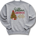 A heather gray crewneck sweatshirt featuring a decorated vintage-style Christmas tree with the words 'Stahlbaum Christmas Eve, Where the Magic Begins'.