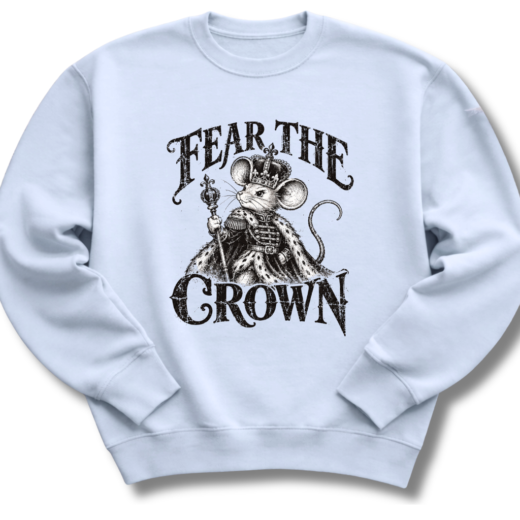 A light blue crewneck sweatshirt featuring a crowned, sword-bearing mouse in detailed black artwork beneath the words 'FEAR THE CROWN'.