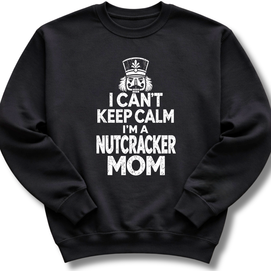 A black crewneck sweatshirt featuring a bold white design with a crowned nutcracker and the message 'I Can't Keep Calm, I'm a Nutcracker Mom'.