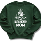A forest green crewneck sweatshirt featuring a bold white design with a crowned nutcracker and the message 'I Can't Keep Calm, I'm a Nutcracker Mom'.