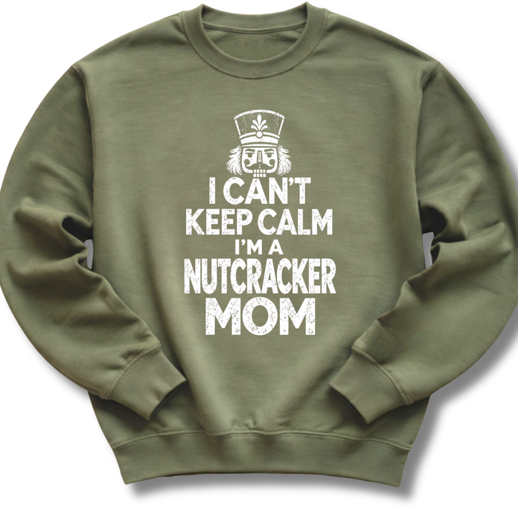 A military green crewneck sweatshirt featuring a bold white design with a crowned nutcracker and the message 'I Can't Keep Calm, I'm a Nutcracker Mom'.