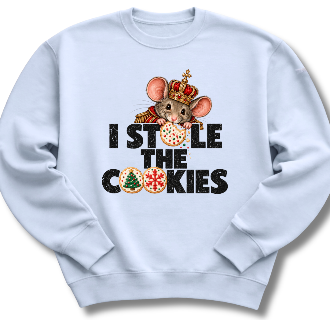 A light blue crewneck sweatshirt featuring a crowned character with candy-cane details and festive 'I Stole the Cookies' lettering.