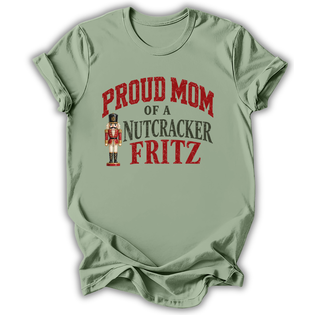 A sage green short-sleeve t-shirt printed with the “Mom of a Nutcracker Fritz” graphic design.