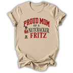 A sand beige short-sleeve t-shirt printed with the “Mom of a Nutcracker Fritz” graphic design.