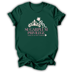 A dark green short-sleeve t-shirt with a graphic on the front featuring a white crown, wand, and star, with the text 'SUGARPLUM PRIVILEGE' in pink and 'SOME OF US ARE FLOWERS' in white.