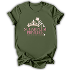An olive green short-sleeve t-shirt with a graphic on the front featuring a white crown, a ribbon, and the text 'SUGARPLUM PRIVILEGE' in pink and white, with 'SOME OF US ARE FLOWERS' below it.