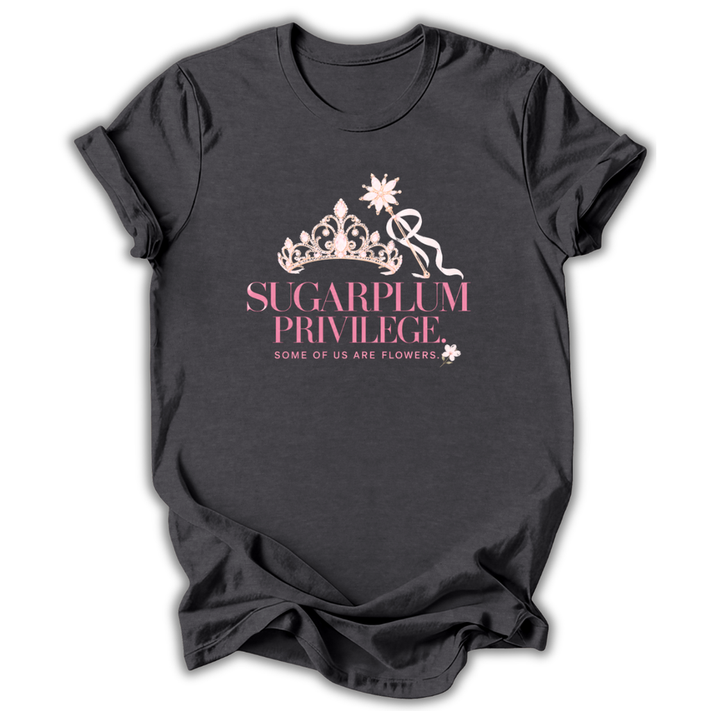 A dark charcoal gray t-shirt with a pink graphic on the front featuring a crown, a ribbon, and the text 'SUGARPLUM PRIVILEGE' and 'SOME OF US ARE FLOWERS'.