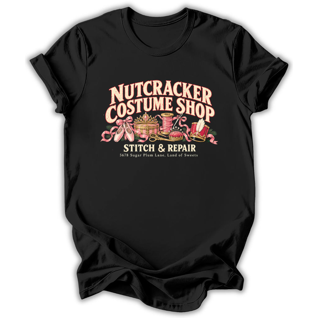 A black short-sleeve t-shirt printed with the “Nutcracker Costume Shop” graphic design.
