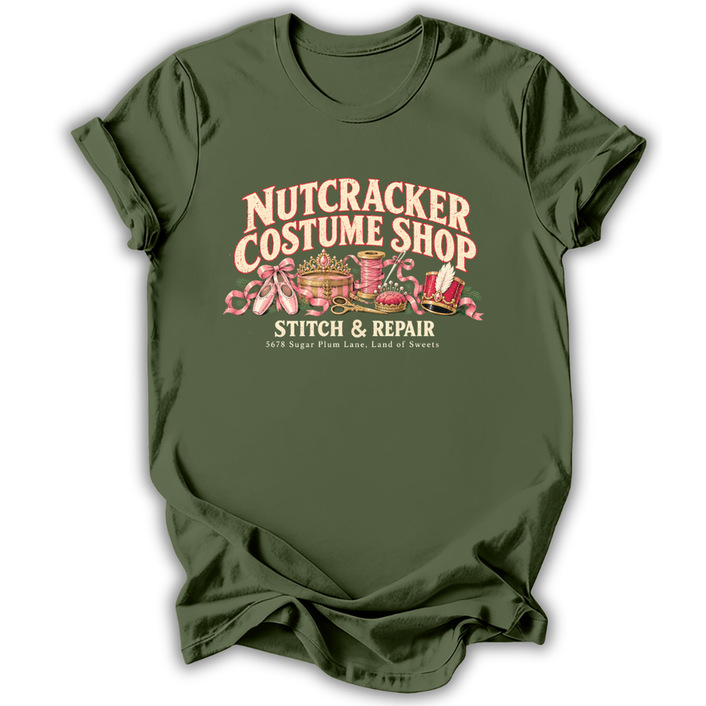 A military green short-sleeve t-shirt printed with the “Nutcracker Costume Shop” graphic design.