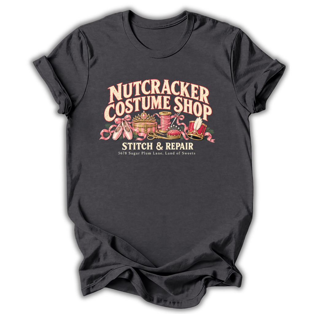 A dark heather gray short-sleeve t-shirt printed with the “Nutcracker Costume Shop” graphic design.