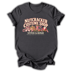 A dark heather gray short-sleeve t-shirt printed with the “Nutcracker Costume Shop” graphic design.