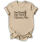 A sand beige short-sleeve t-shirt printed with the “Proud & Tired Nutcracker Mom” graphic design.